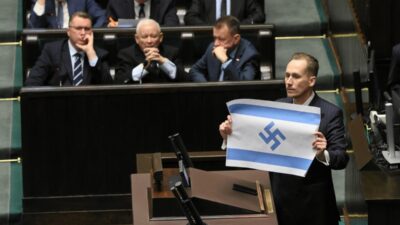 Polonyali milletvekili i srail i ozel siddetle soykirim la sucladi ve nazi semboluyle degistirilmis i srail bayragi gosterdi 61948